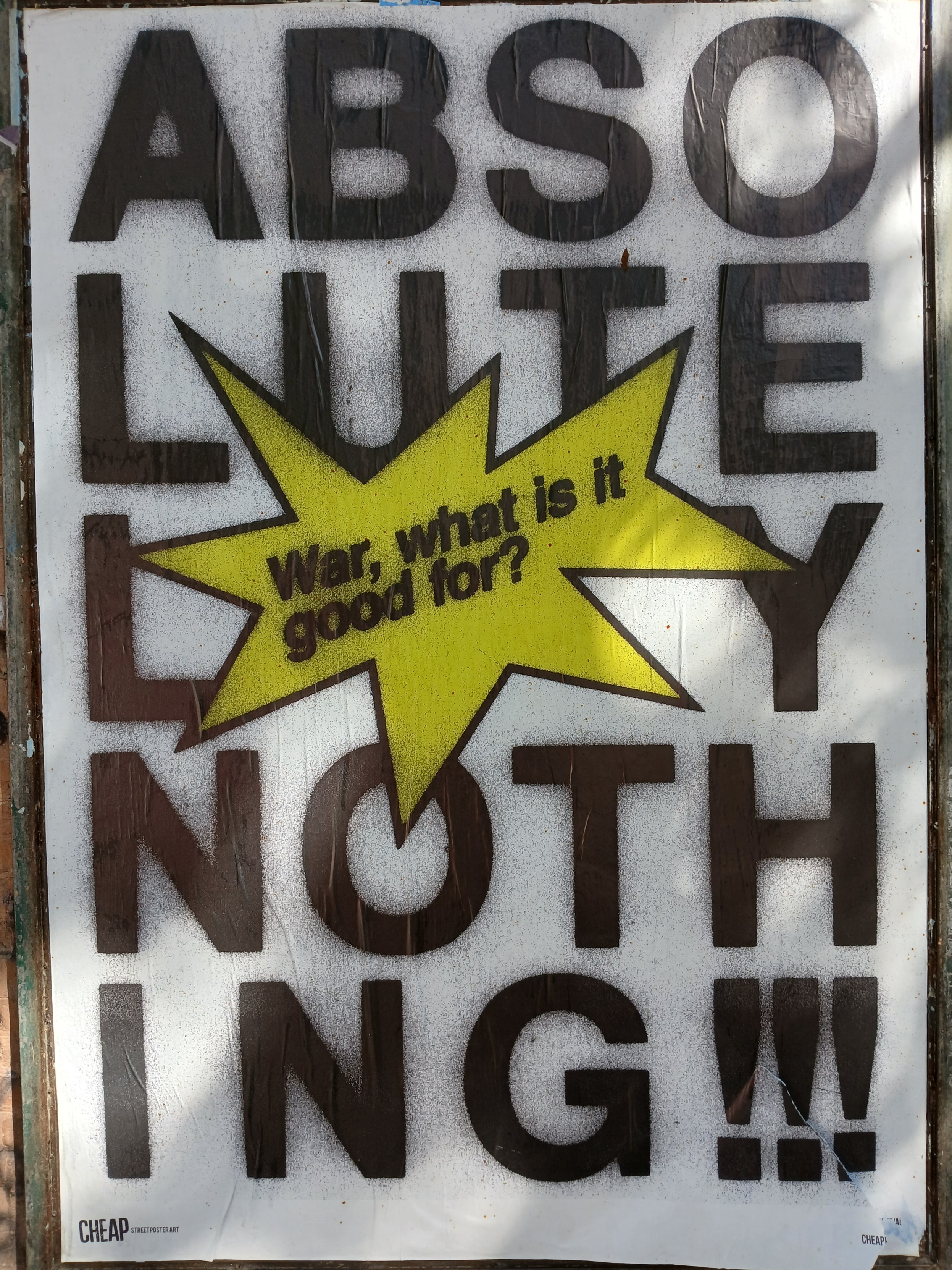 Poster with a bright yellow speech bubble saying "War, what is it good for?"
Behind, in black on white in large letters it says "absolutely nothing". 