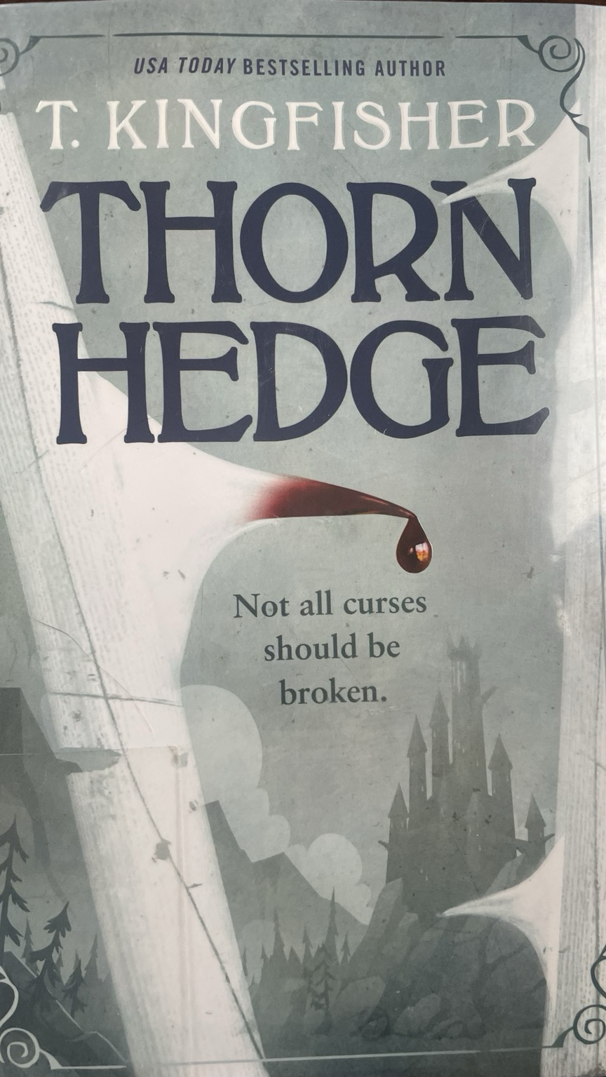 Book cover featuring a thorn with blood on it