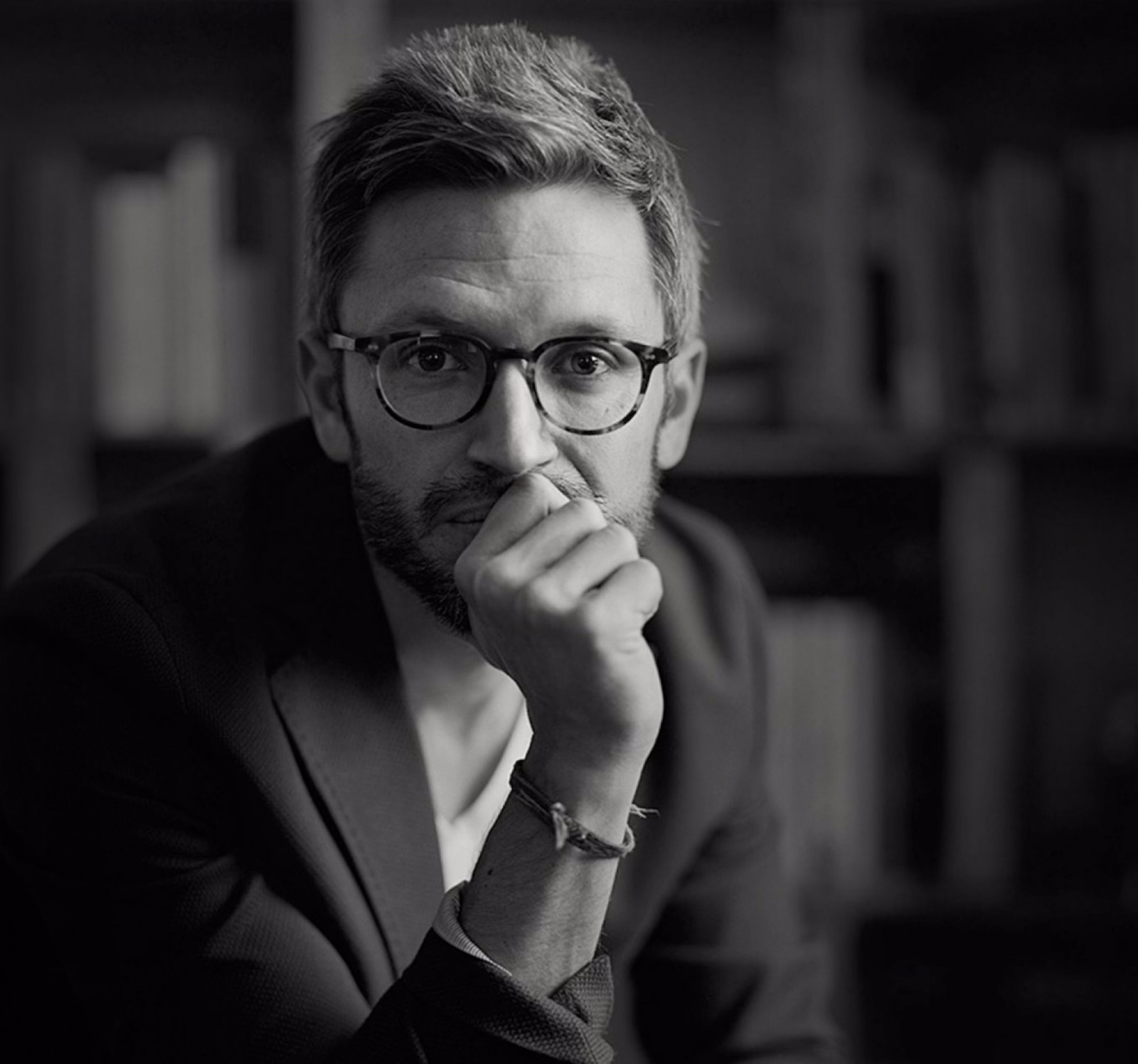 Black-and-white photo of Professor Jason Hickel looking into the camera.