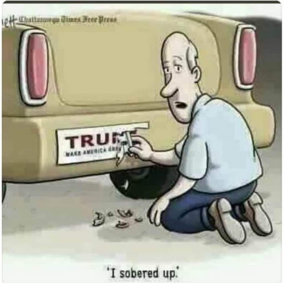 A kneeling man peeling a white Trump bumper sticker off his gold colored car. "I sobered up."